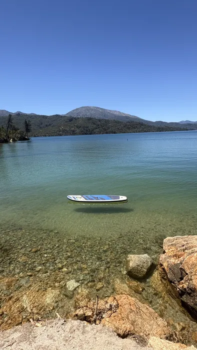 A paddleboard below the mountain ridge across Whiskeytown Lake